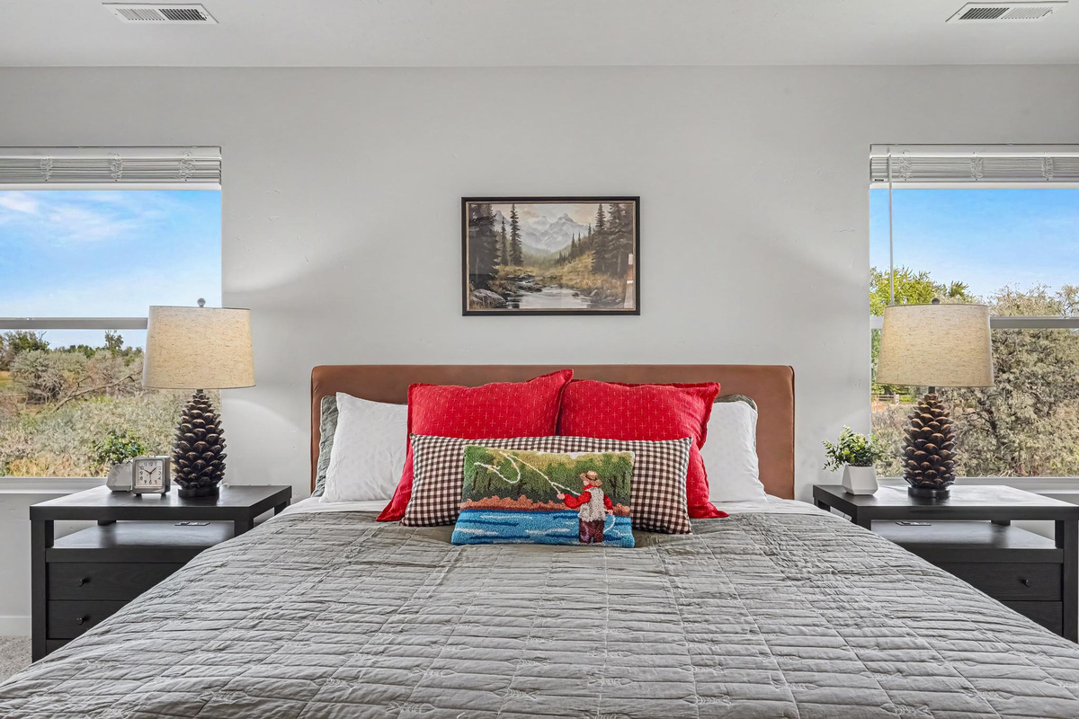 Relax in the comfort of a California king-size bed, complete with plenty of plush pillows to ensure a cozy and restful night's sleep.