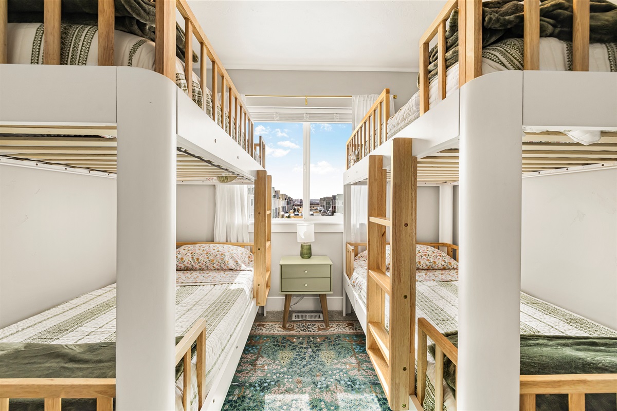Third bedroom with two bunk beds, perfect for families or children.