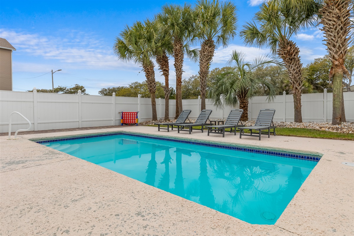 Lounge in the sun next to the huge pool