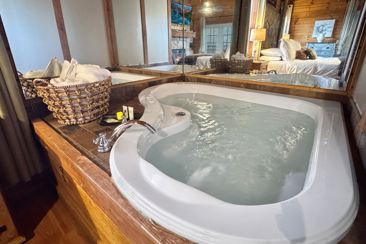 End the day soaking together in warm, bubbling water — candles lit, stress gone