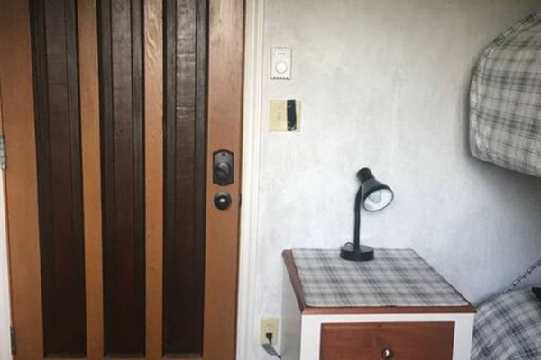 Bunkhouse entrance, side table and beds