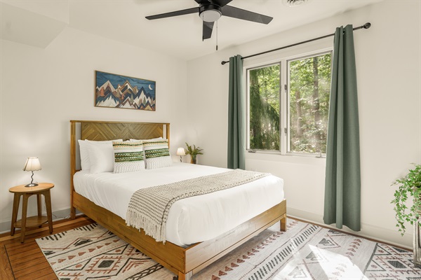 Upstairs queen bedroom with hanging closet and dresser.