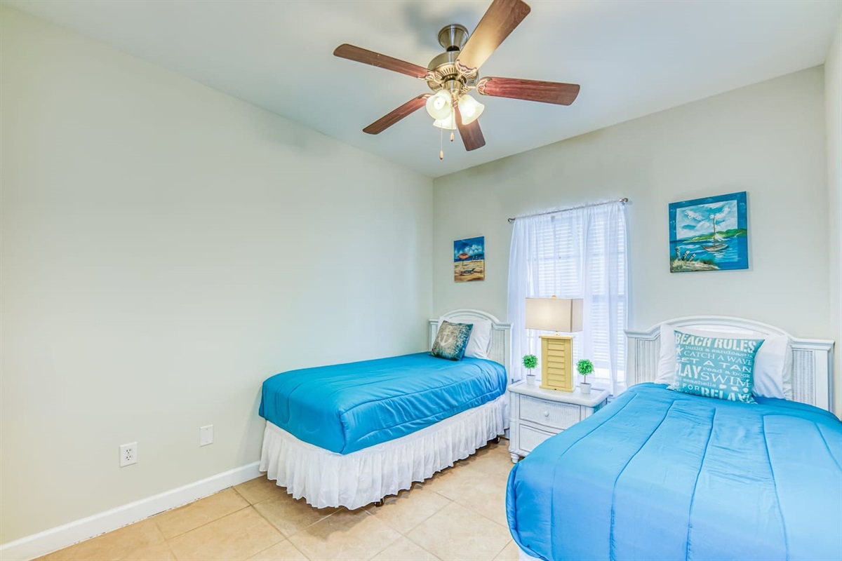 Twin Room: Bright decor and beachy vibes await for a fun-filled stay in Orange Beach!