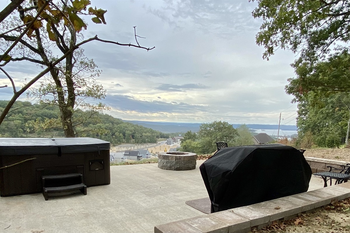 Private hot tub and fire pit with a lake view!