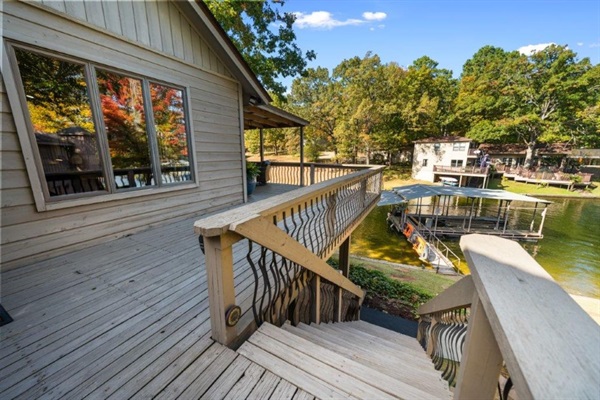 The deck off the kitchen, steps down to the grilling station — Breakaway on Lake Hamilton