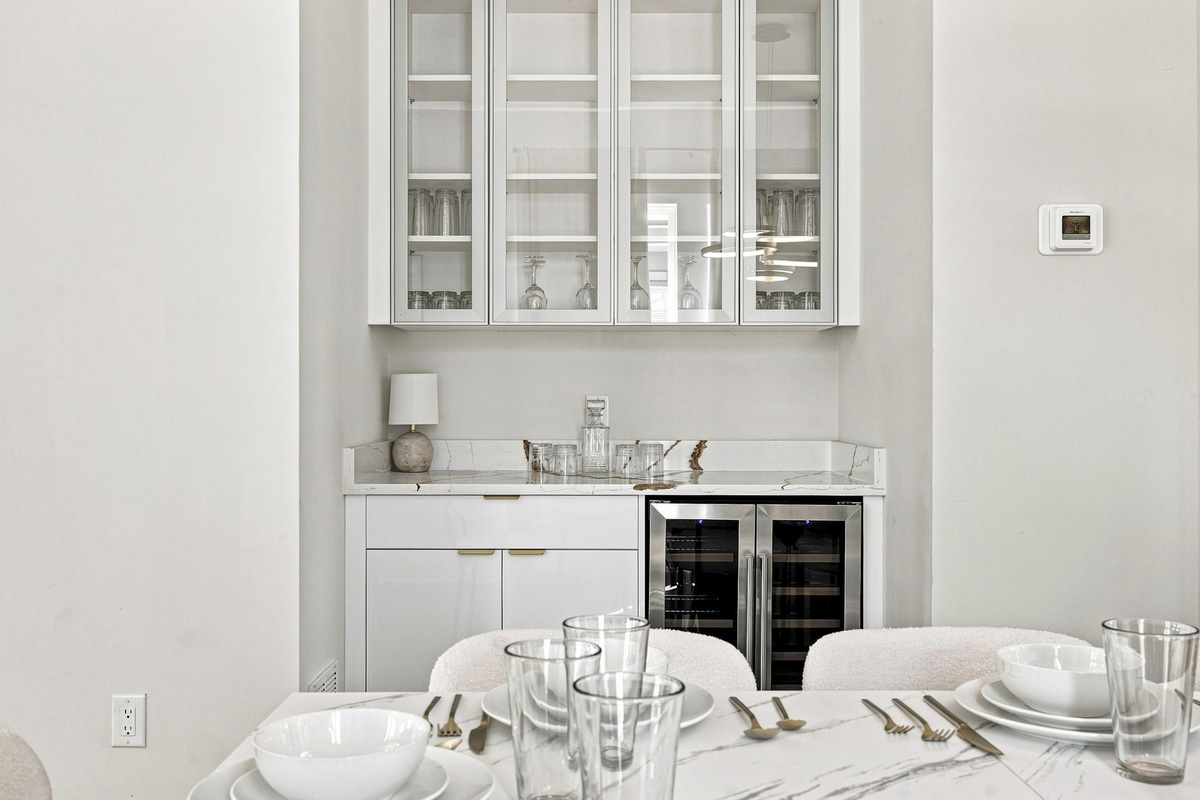 Elegant marble-top bar with chic glassware, perfect for entertaining guests!