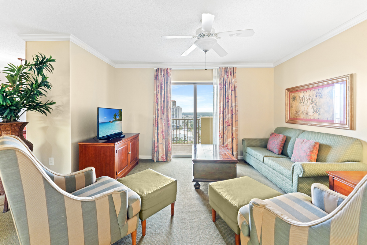 Open Livingroom with sleeper sofa and balcony access