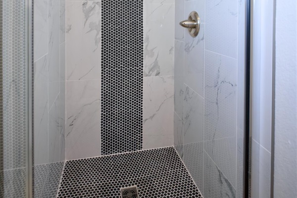 Main ensuite bathroom has separate shower and soaking tub.