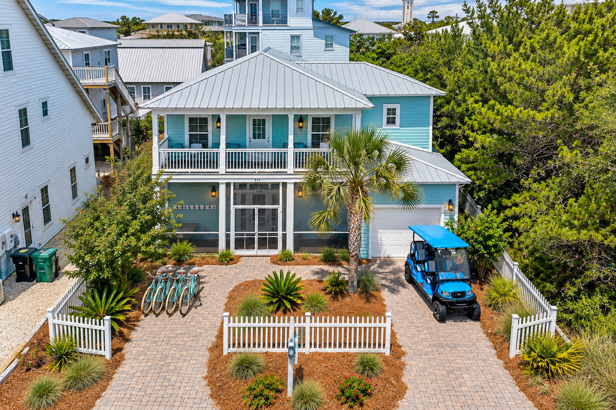 Beautiful coastal home with a spacious driveway, four complimentary bicycles, and a six seat golf cart, offering guests easy access to explore the area in style.

