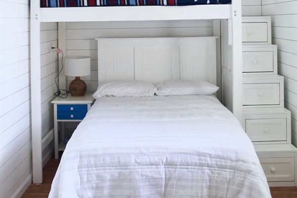 Basement room. Full bed and twin bed. Located off carport, back of house.