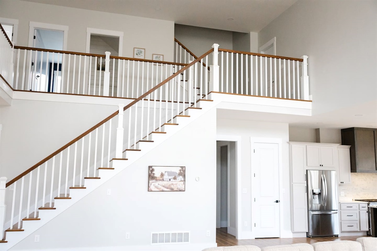 The master bedroom is off the hallway under the steps. The other four bedrooms are off the 2nd floor balcony. The 3rd floor has a movie room, ping pong table, additional workspace, beds, and couches. Plus game systems, board games, and toys.