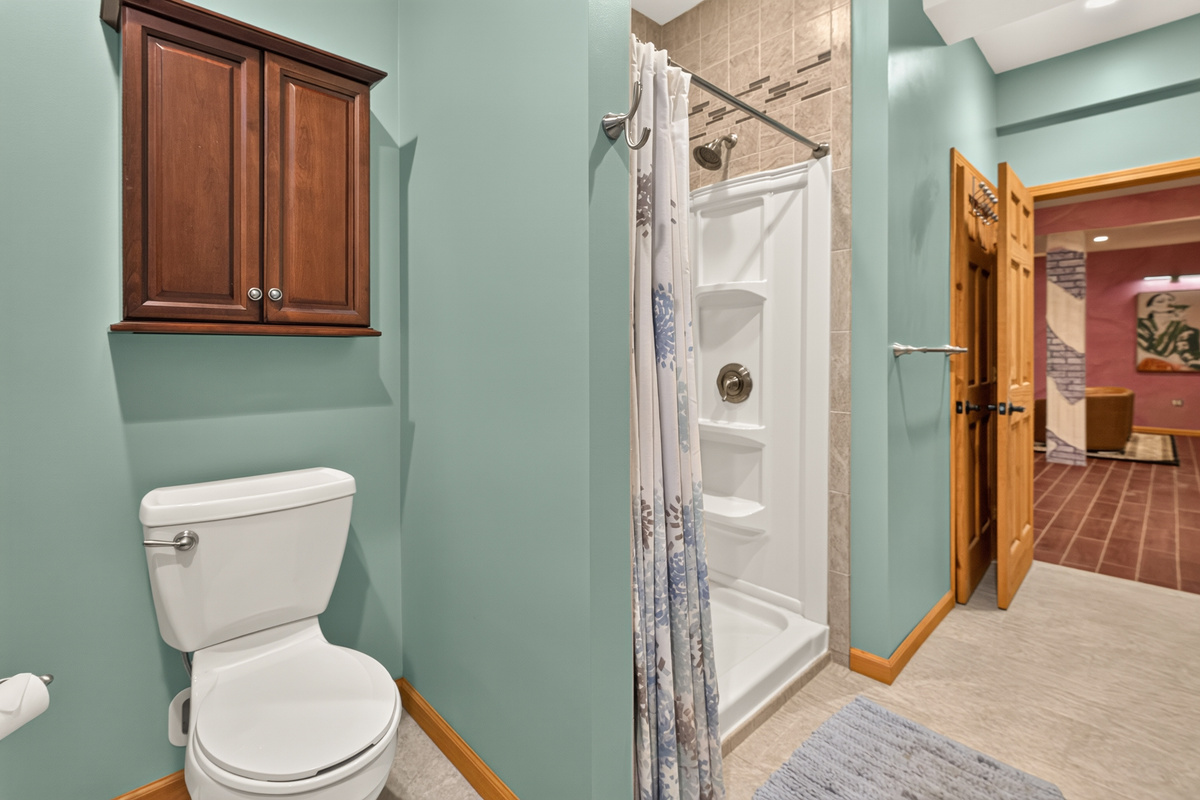 Bathroom with glass shower and toilet