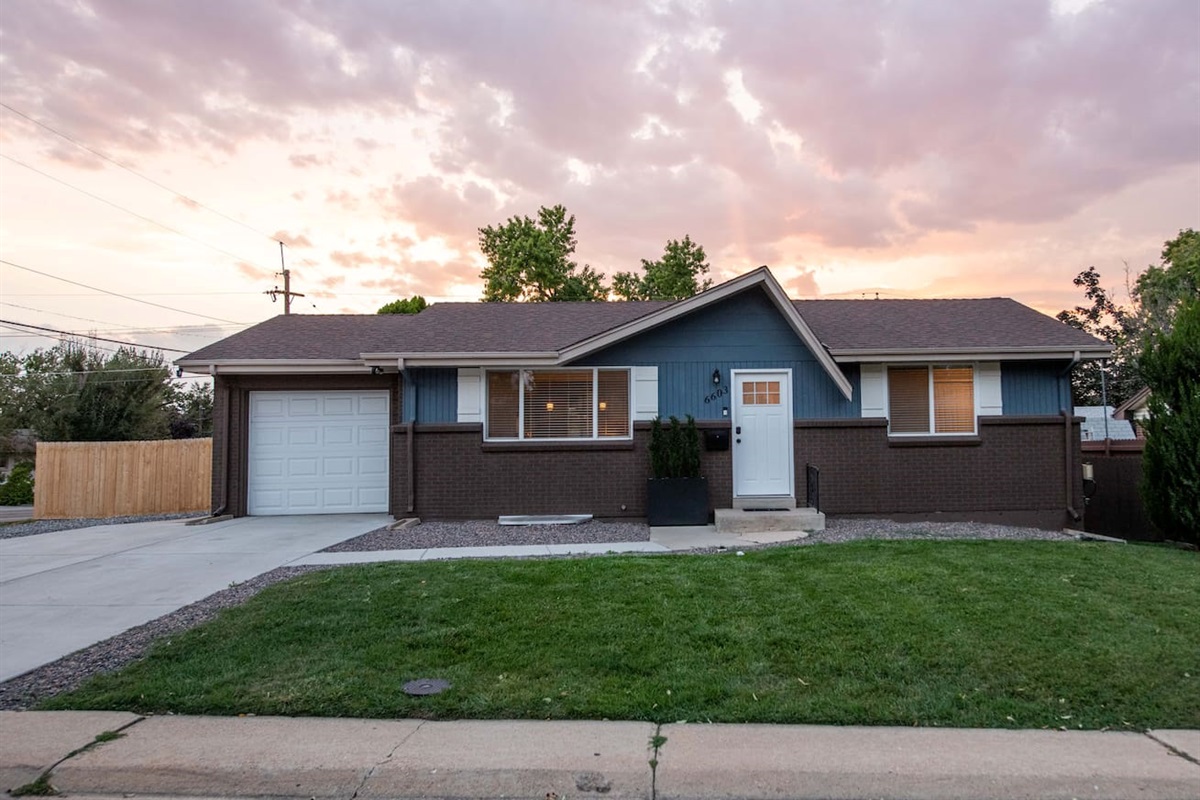 Front of home and main entrance (note garage remains locked for storage and backyard is accessed by walking around the garage to backyard).
