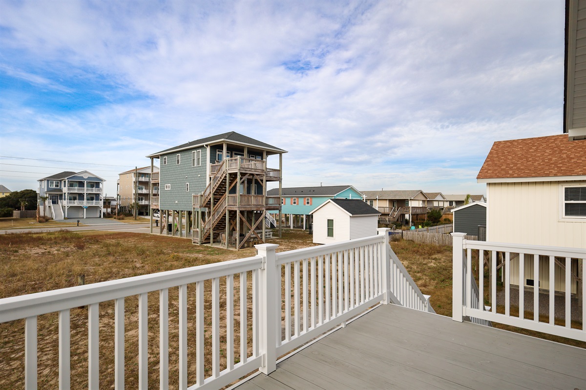 Relax on the deck and enjoy open views of the coastal neighborhood