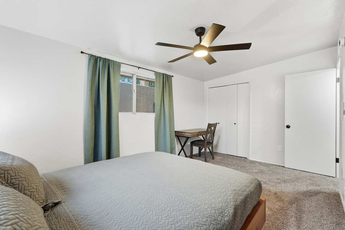 Comfort: This second bedroom offers ample space and soft, calming neutral tones.
