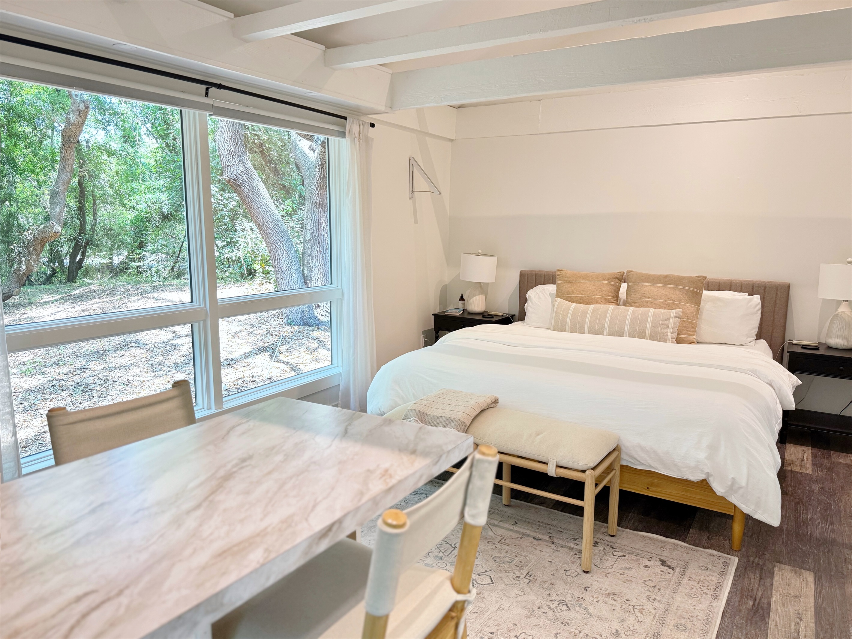 The guest cottage is a Studio with Kitchenette + huge picture window overlooking beautiful Live Oaks.