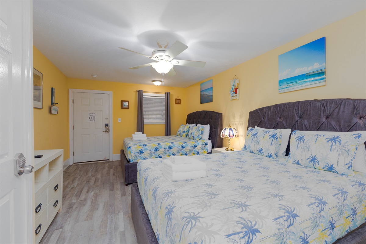 Bright, open sleeping area with two Queen beds&mdash;perfect for families or friends to relax