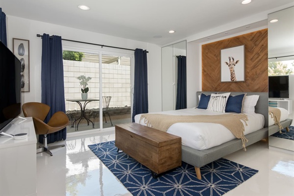 Front bedroom with queen bed and private outdoor patio