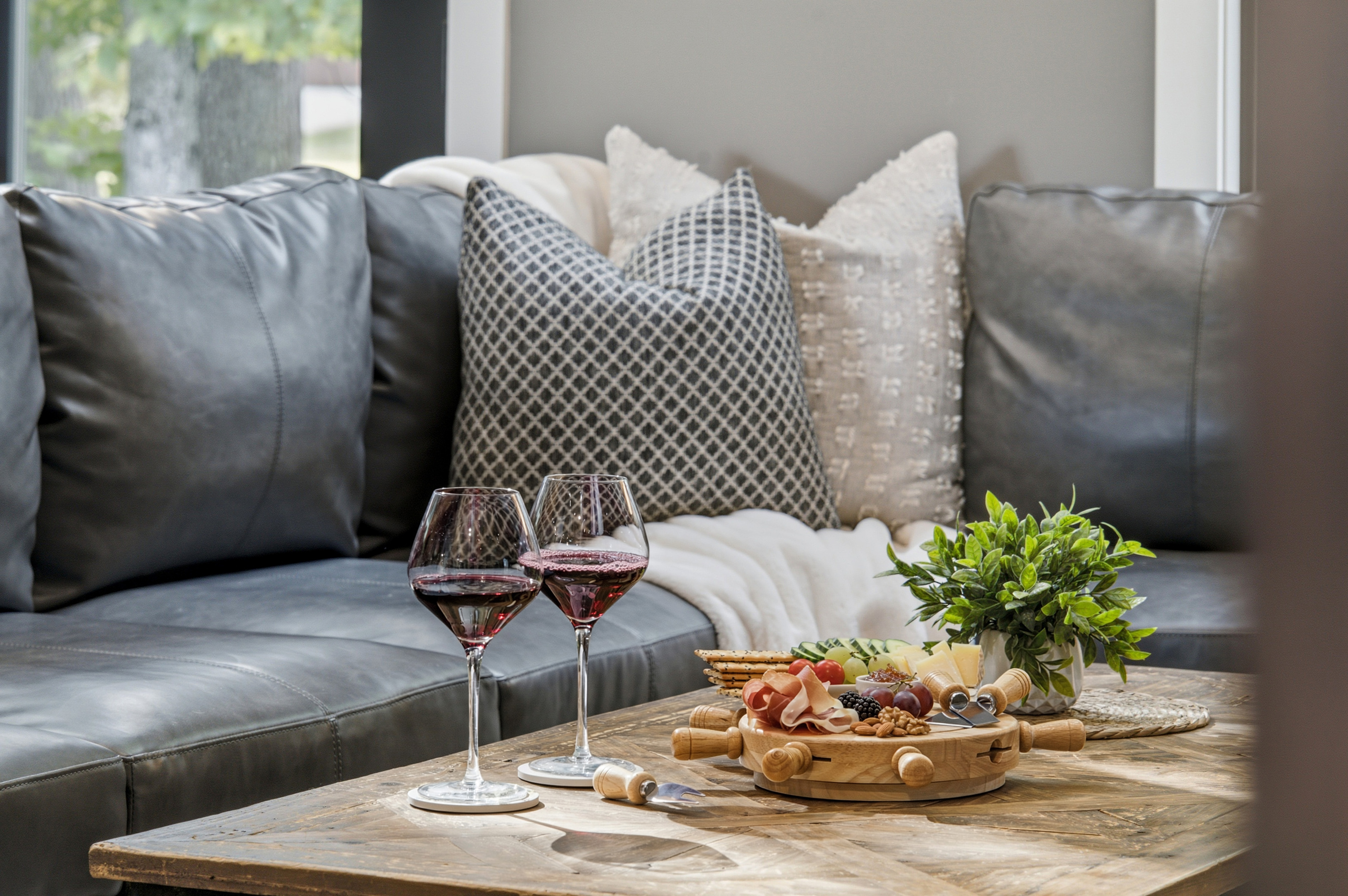 Unwind with wine and a charcuterie board while enjoying a cozy evening together.