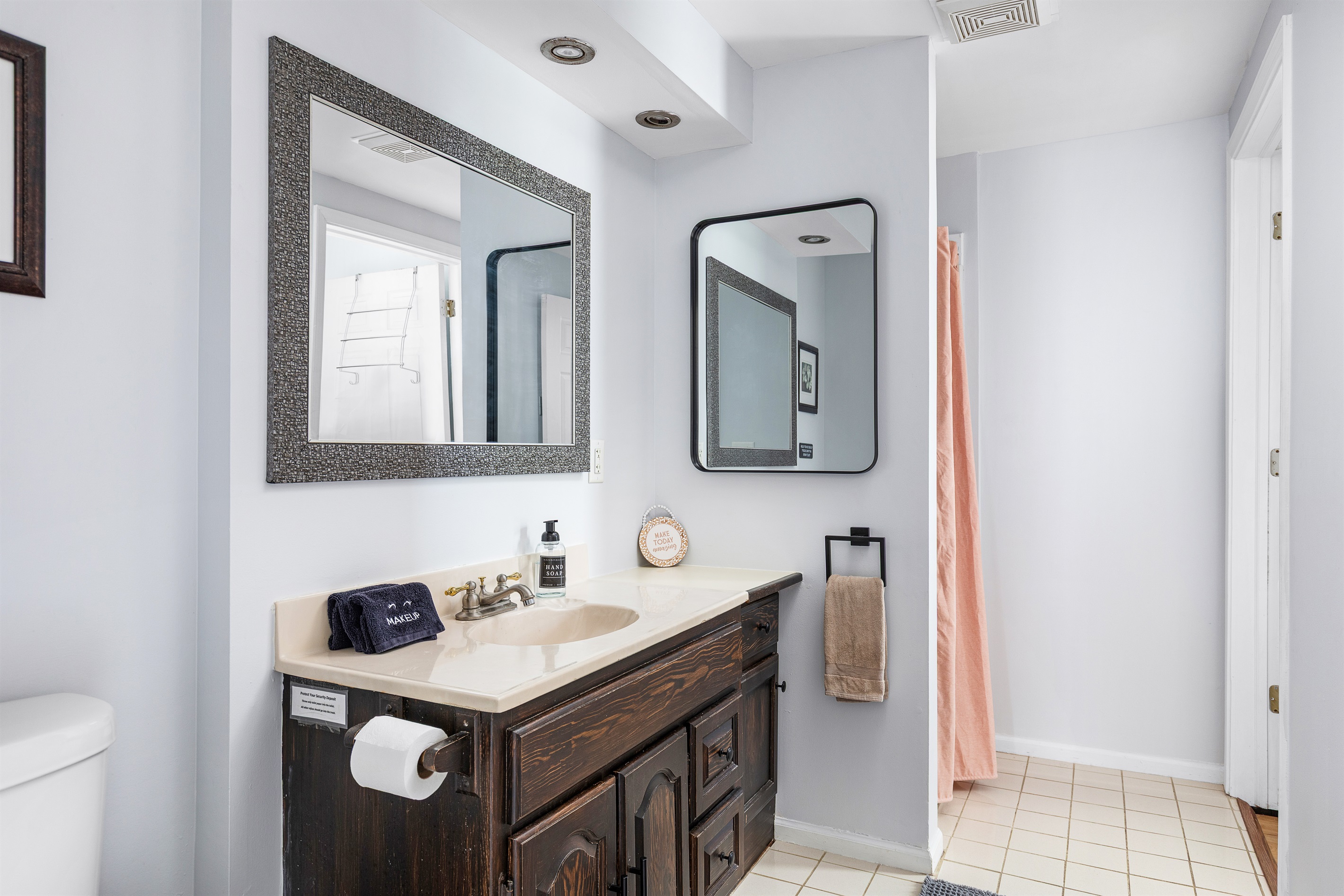 This convenient first floor bathroom with standing shower makes coming and going effortless after beach days.