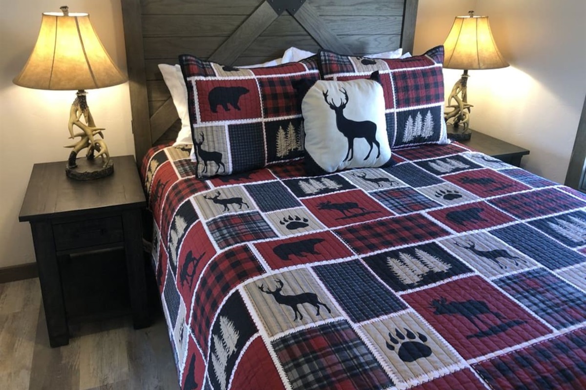 Queen sized bed. Luggage rack and hooks with hangers. 