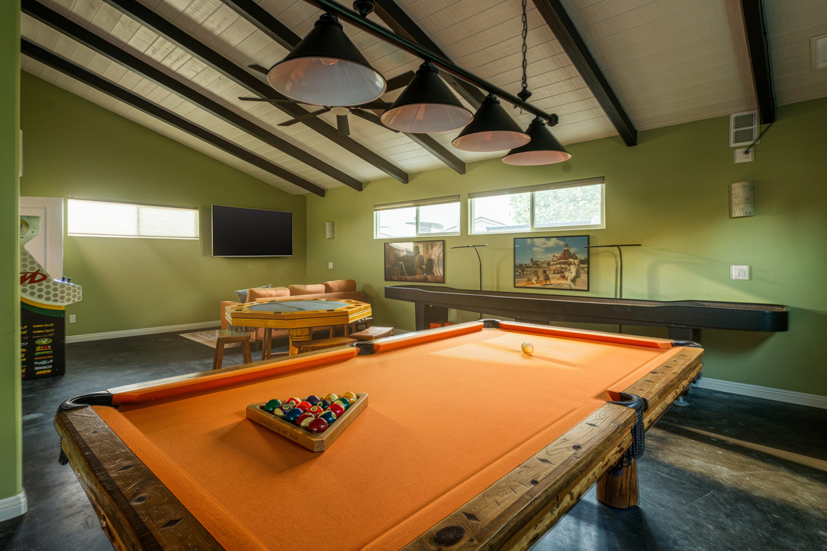 Slate and bamboo 7 ft pool table, shuffleboard table, and poker table