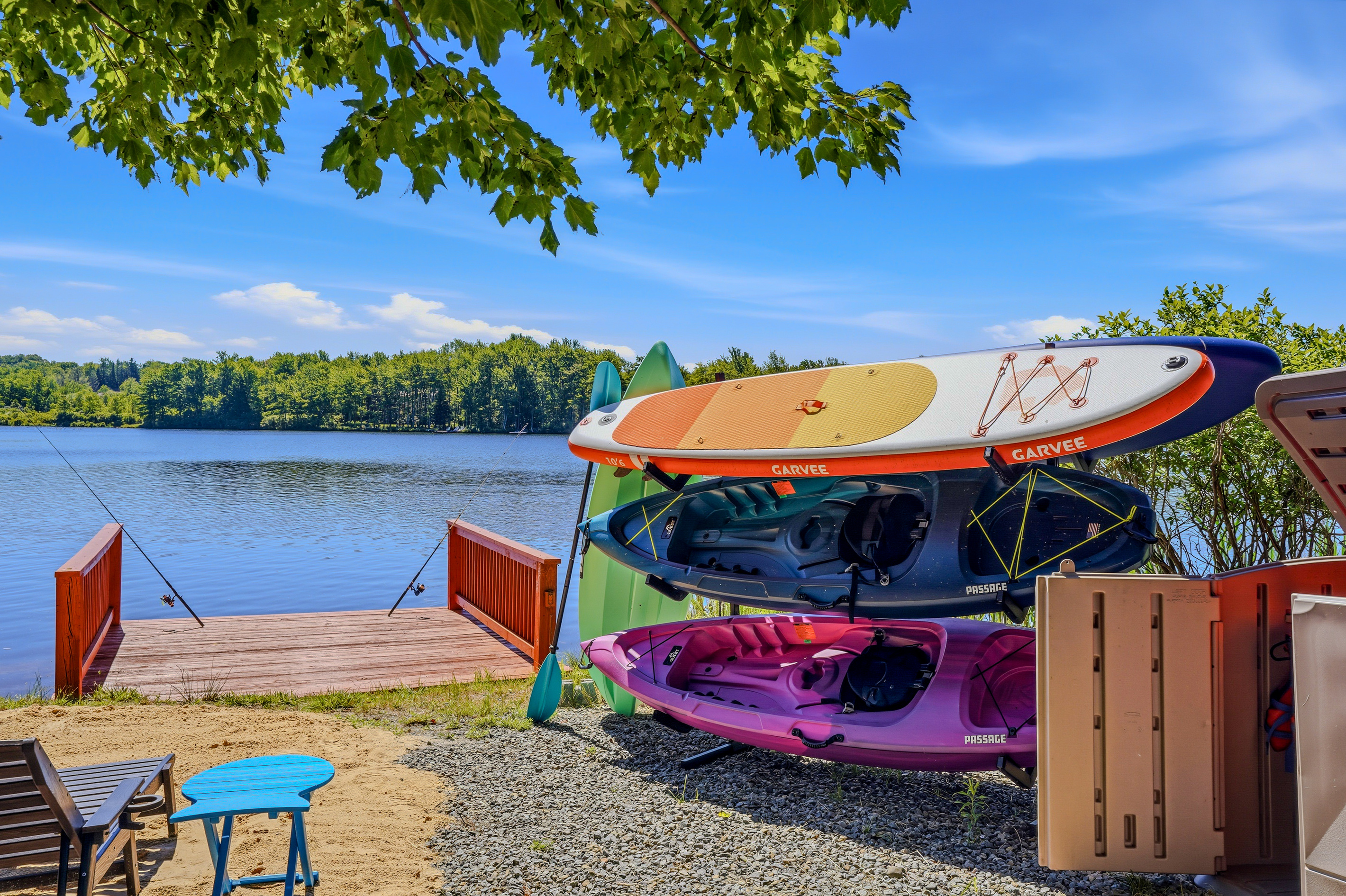 Private dock stocked with kayaks and stand-up paddleboards — the water is steps from your door