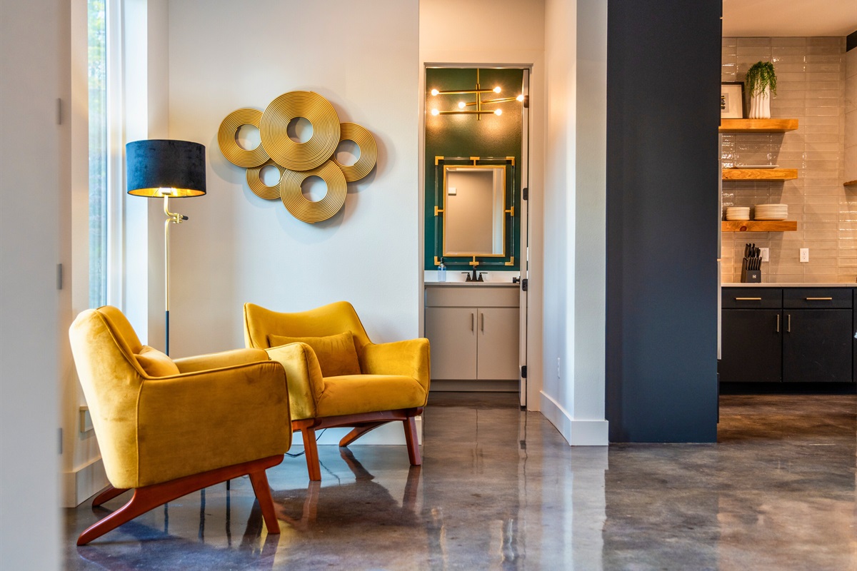 This unique seating area brings a pop of color and charm to the space &ndash; a cozy, stylish spot for quiet moments or catching up with friends.