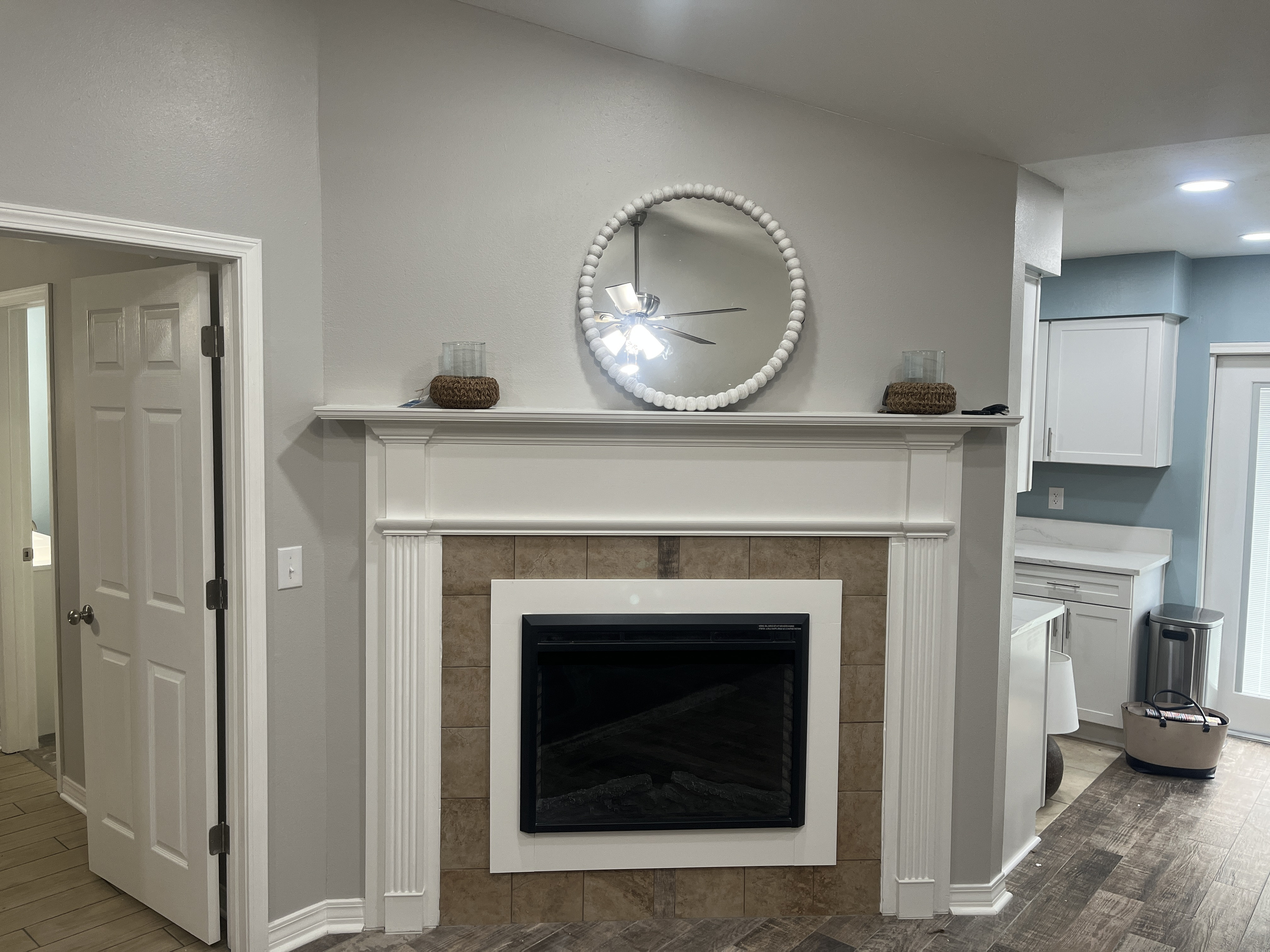 Working electric fireplace. Remote control. Warms up the room with a cozy atmosphere.