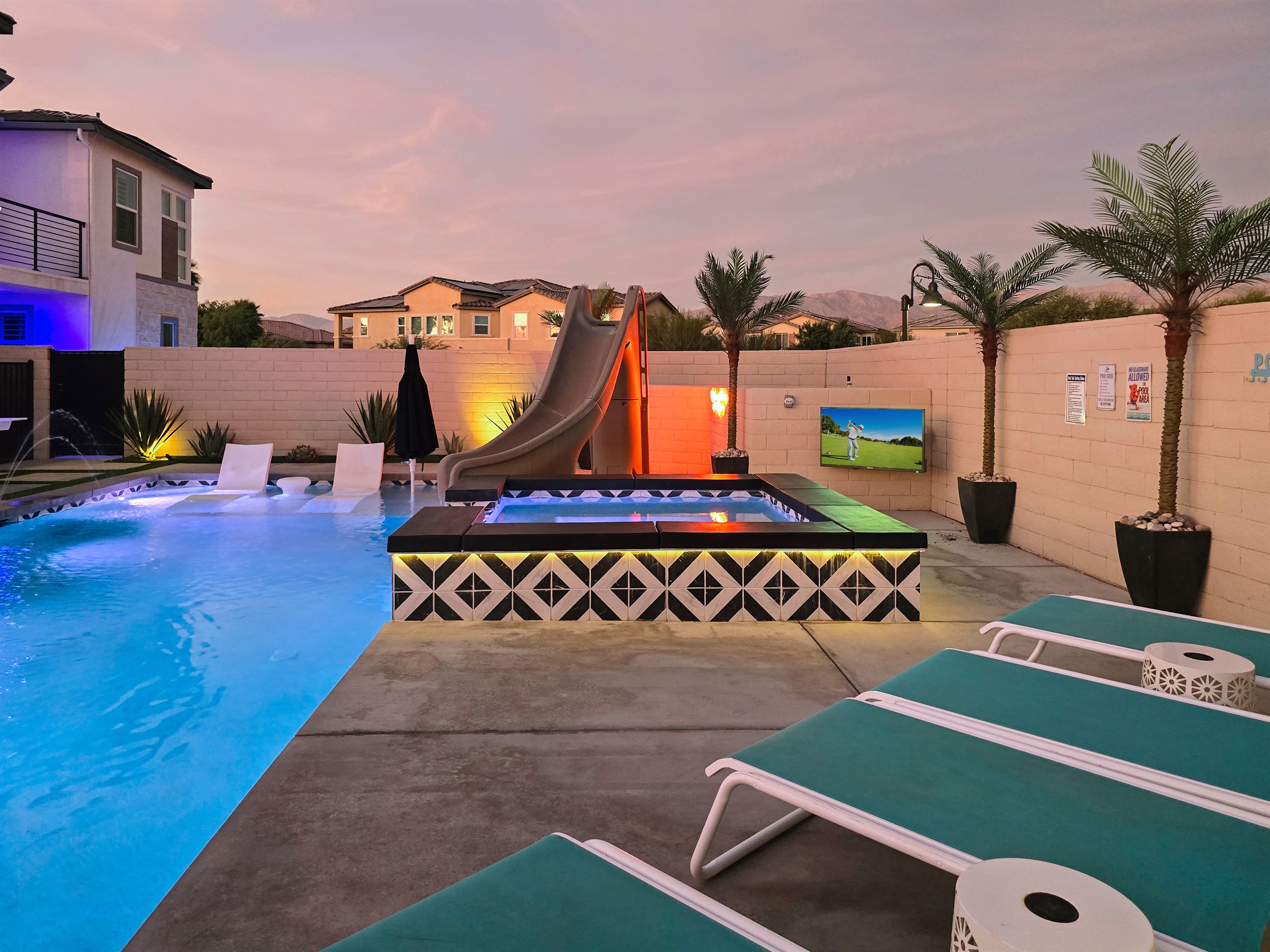 Outdoor TV next to the spa. Never miss your favorite sports game or show.