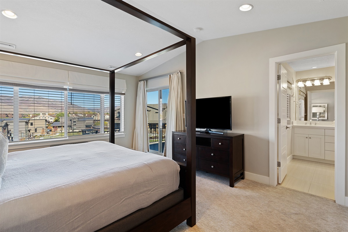 Spacious upstairs primary suite with an ensuite bathroom.