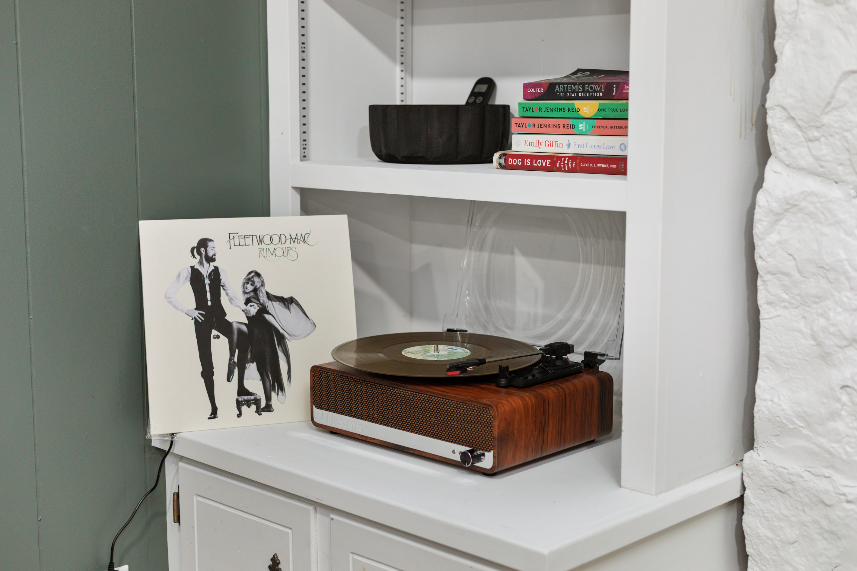 Spin a record on the vintage turntable or connect your phone via Bluetooth to fill the room with your favorite music.