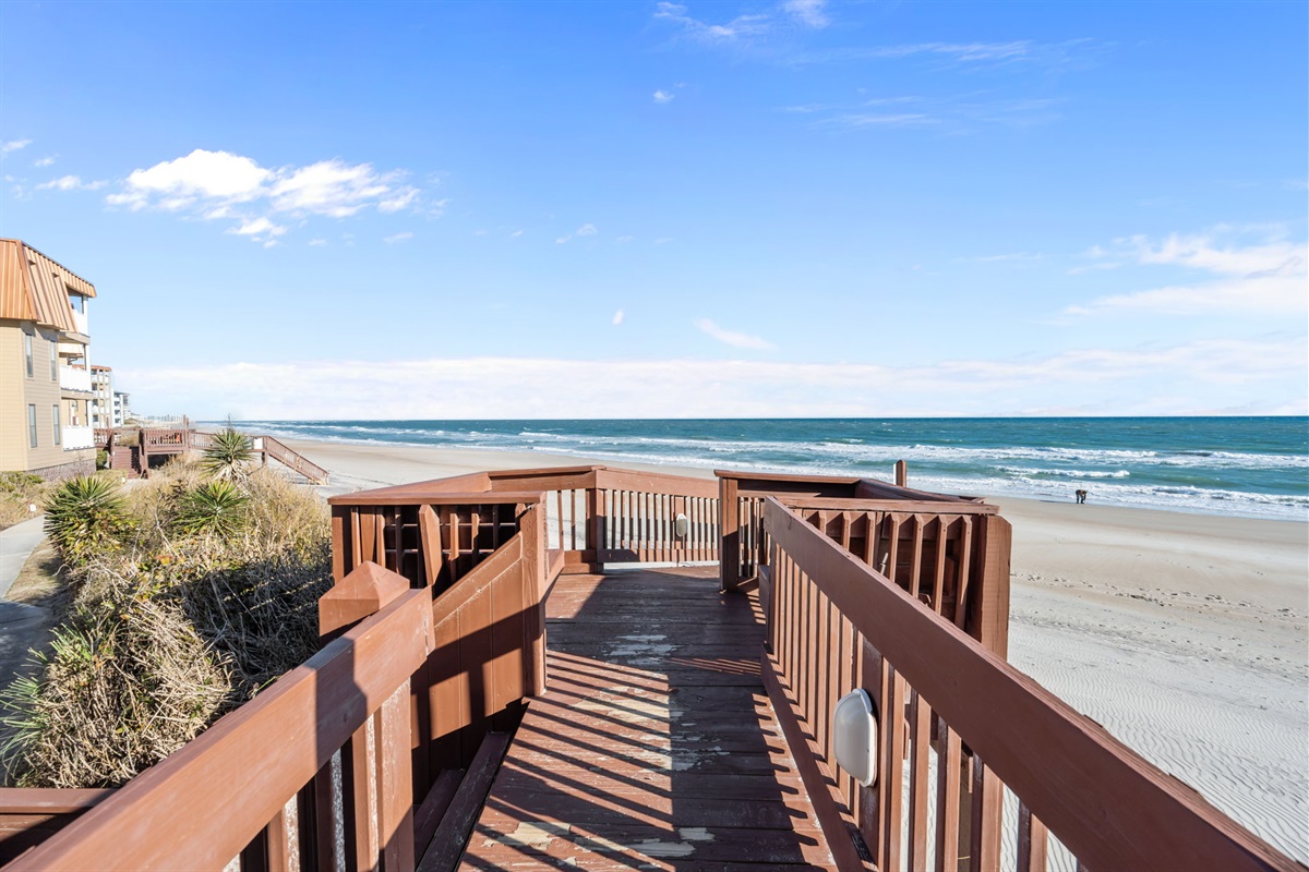 Follow the private boardwalk straight to the beach, with uninterrupted views of the shoreline and easy access to the sand and surf