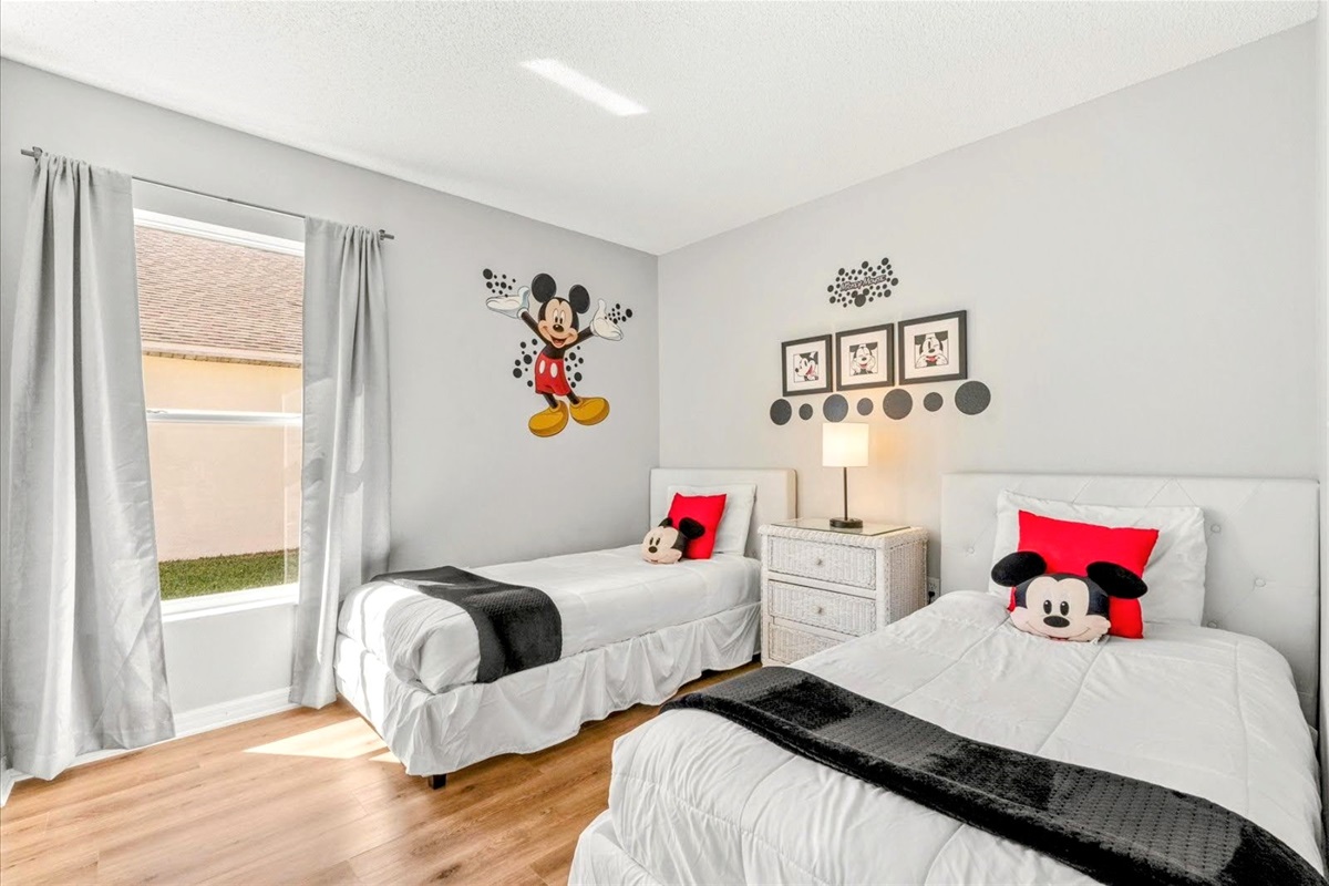 At the third bedroom, you will also meet Mickey Mouse! We have two single beds here .