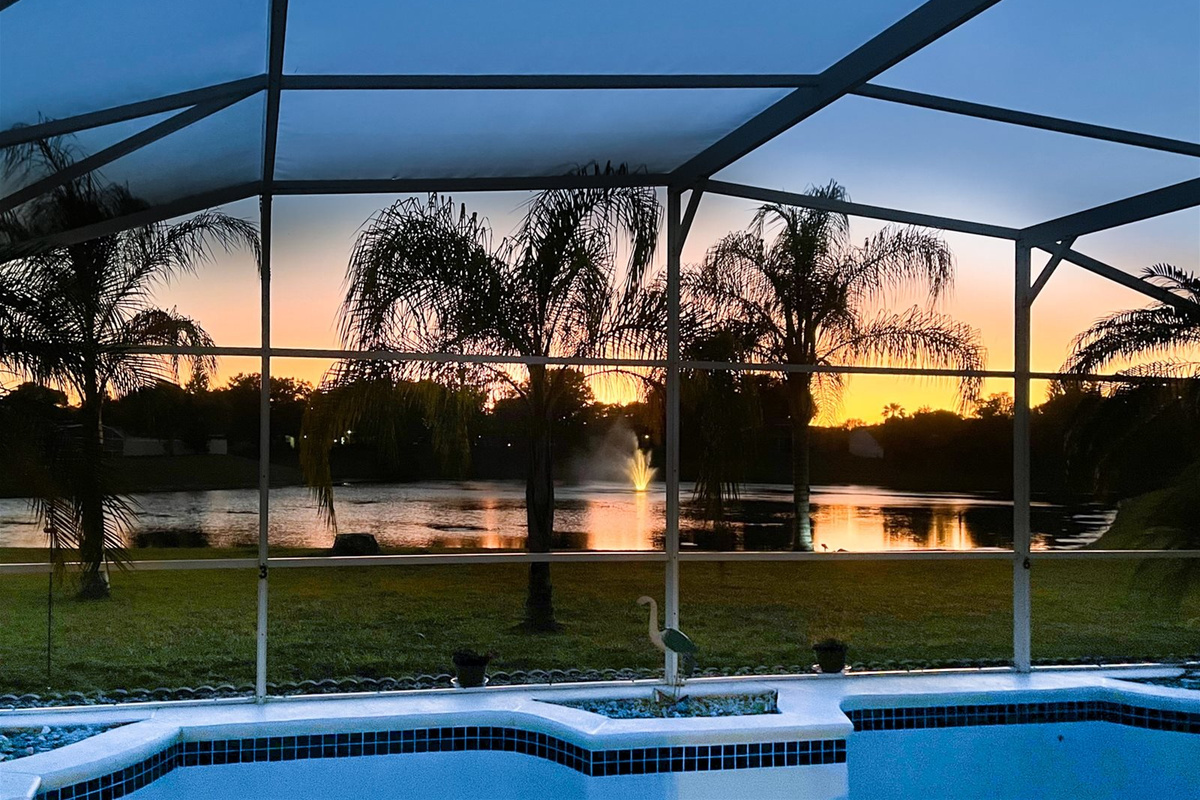 Watch the sun set over the lake from your Private Screened Pool