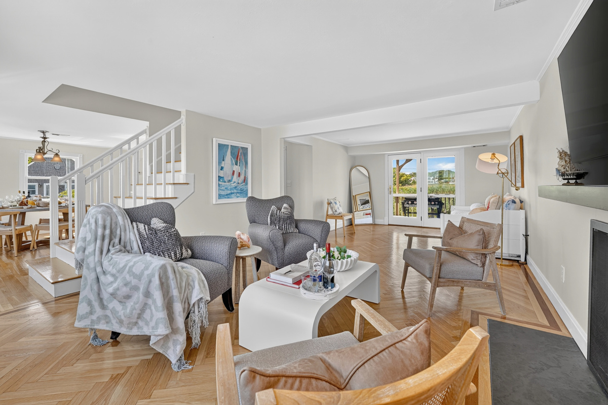 Spacious open-concept living area designed for gathering, relaxing, and enjoying the beautiful waterfront setting.