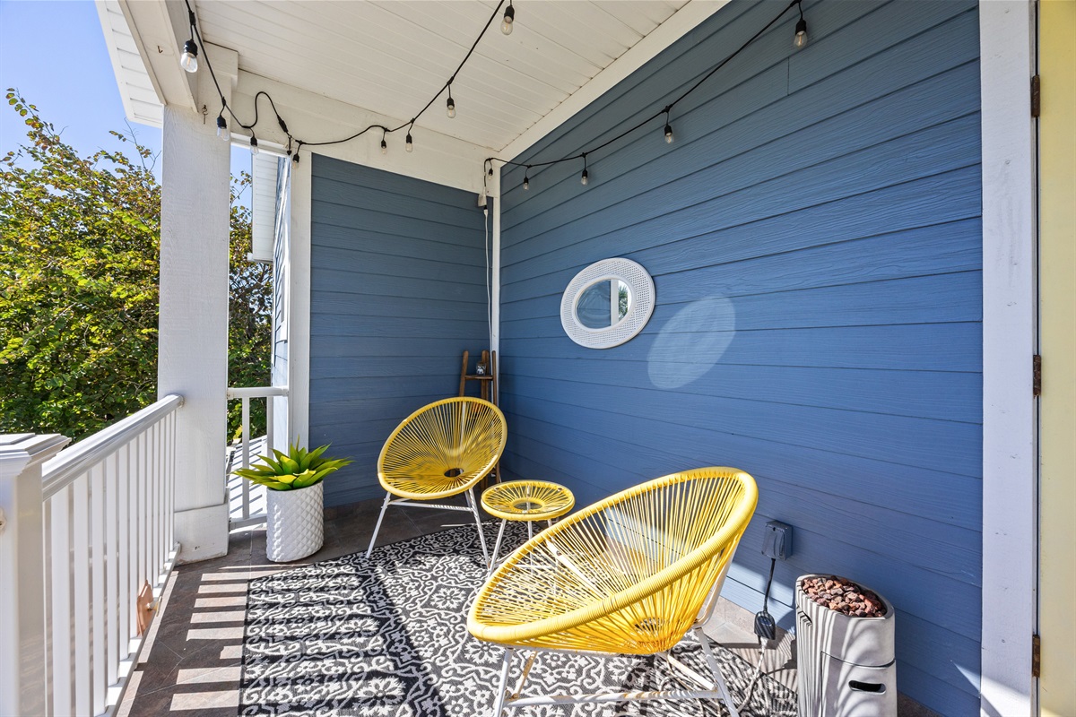 A comfy balcony nook to kick back and enjoy the fresh air.