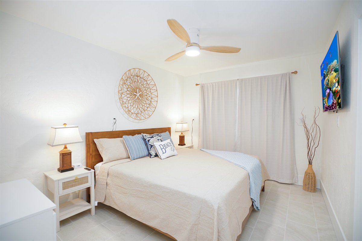 Bedroom one offers a king bed, smart TV and ocean view.