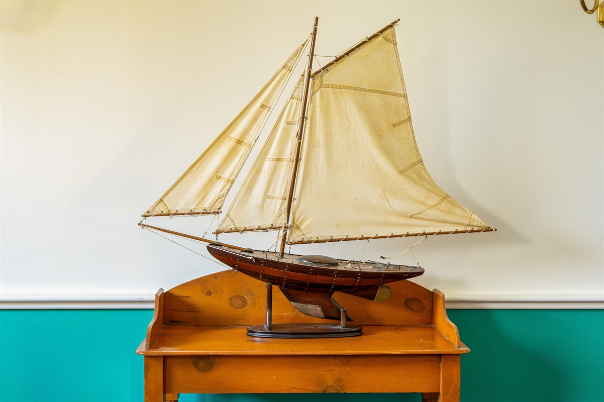 Authentic coastal charm meets colonial elegance. This intricately detailed sailboat model in the dining room celebrates Southwest Harbor’s rich maritime history, adding a touch of local Maine character to your group’s formal dinner gatherings.