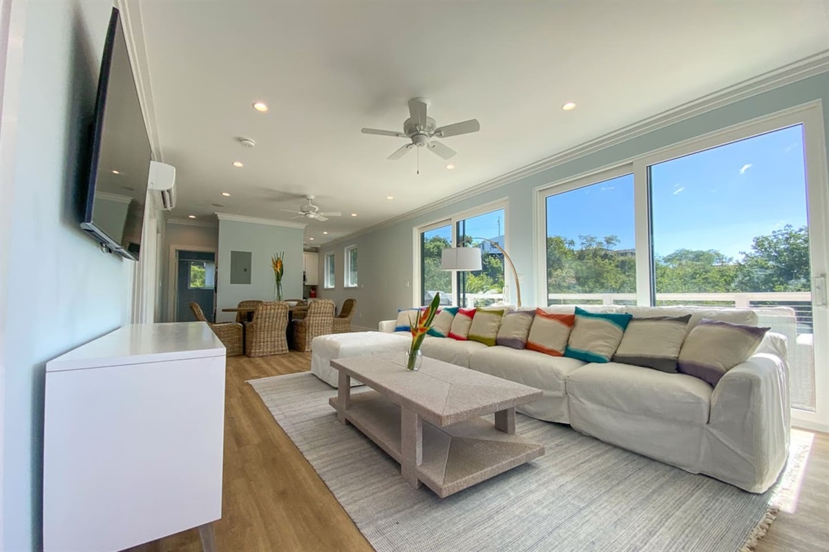 Spacious living room with natural light and modern comforts.