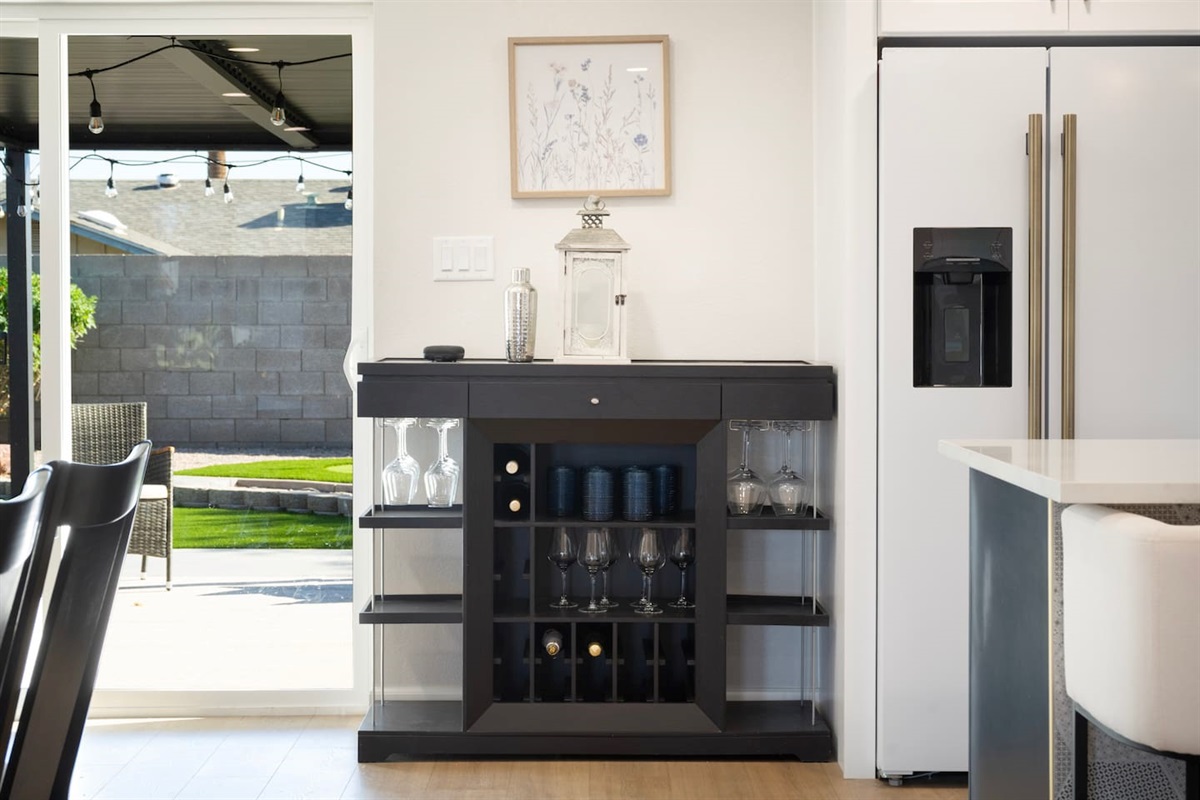 Stylish dining area with bar station and easy access to outdoor patio—perfect for entertaining and relaxing evenings