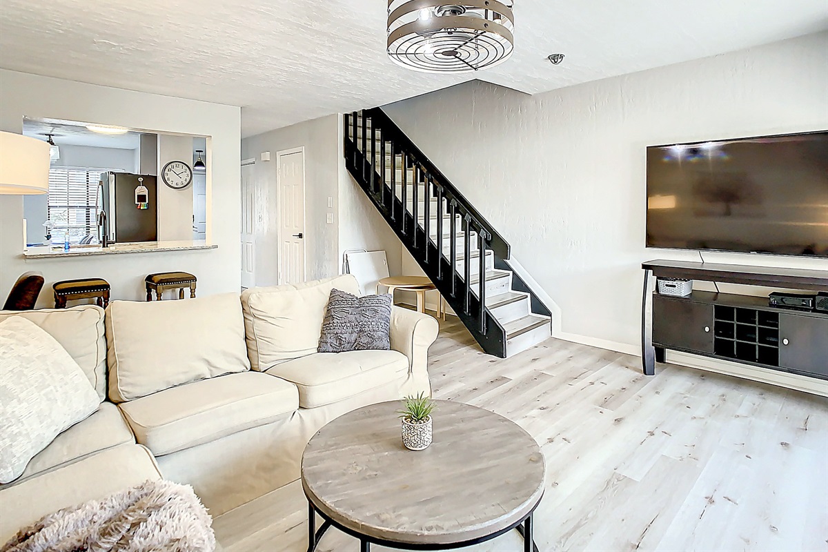 Spacious bedroom with comfortable queen bed, ample closet space, and serene atmosphere perfect for a relaxing stay.