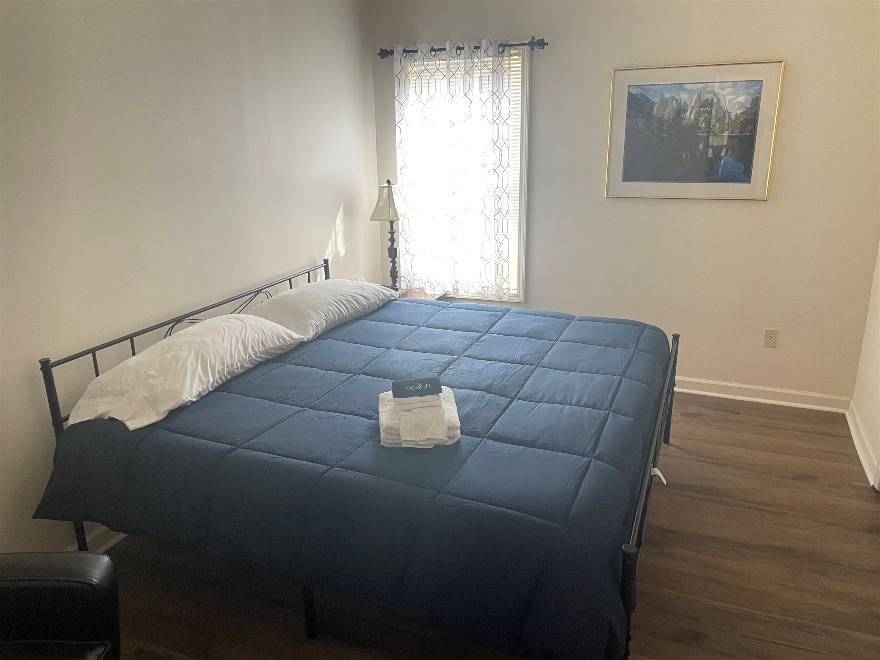 Plenty of space to relax and enjoy the large king bed in the secondary king room with smart tv and sitting area. 