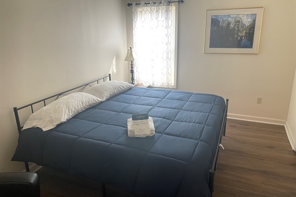 Plenty of space to relax and enjoy the large king bed in the secondary king room with smart tv and sitting area. 