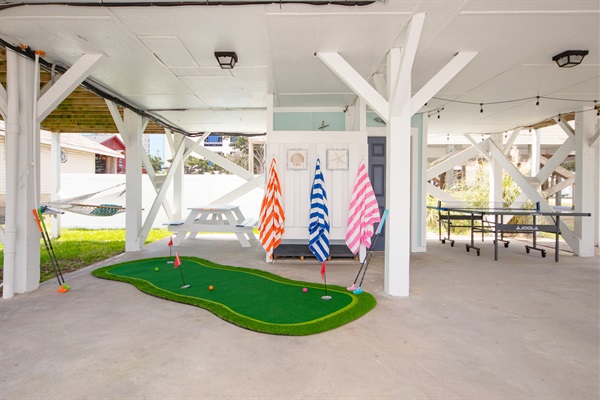 Putt Putt mini golf under house for some family fun.
