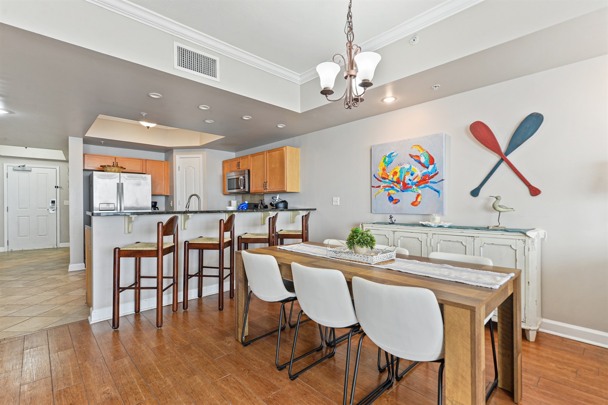 Dining room table seats 6-8. Kitchen bar seats 4.
