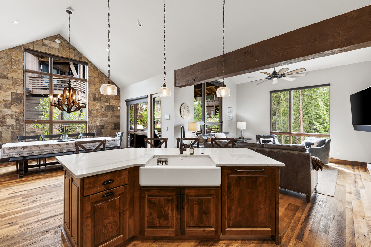 Kitchen island with view of dining area on left and living area on right