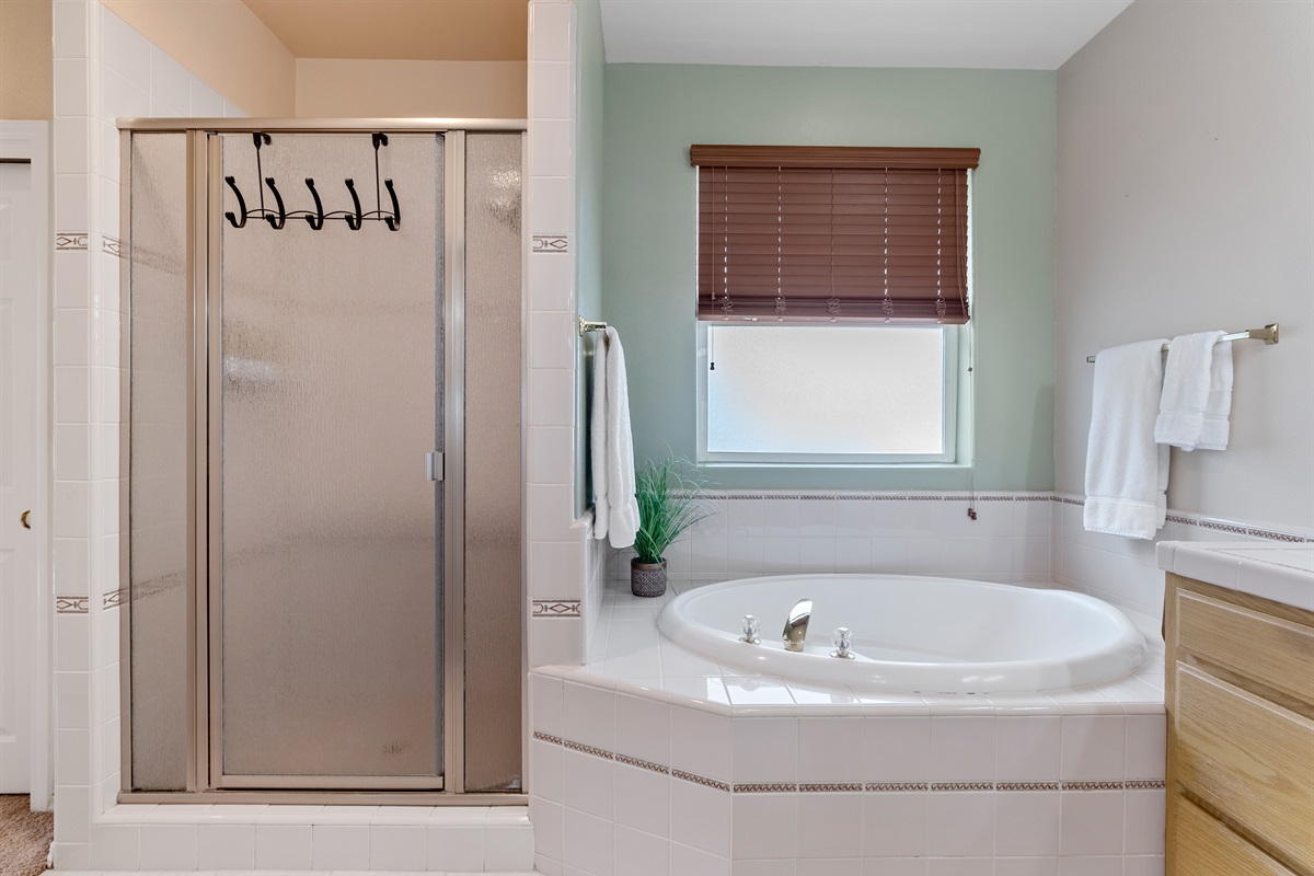 Primary ensuite includes soaking tub and separate shower.