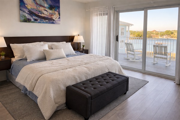 Light-filled primary bedroom with king-size bed