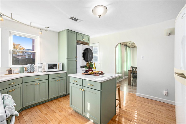 Island seating in kitchen with lots of countertop space